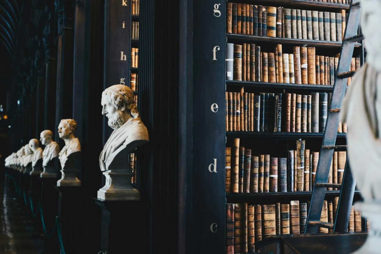 Historic law library with marble busts and old legal books symbolizing tradition and cybersecurity awareness in law firms.