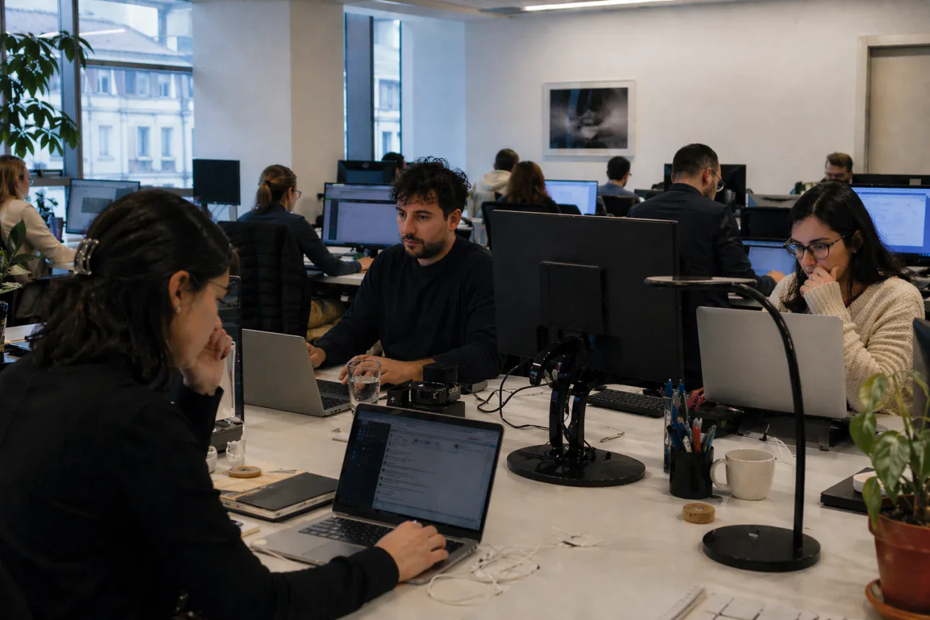 Employees working on their computers in a modern office